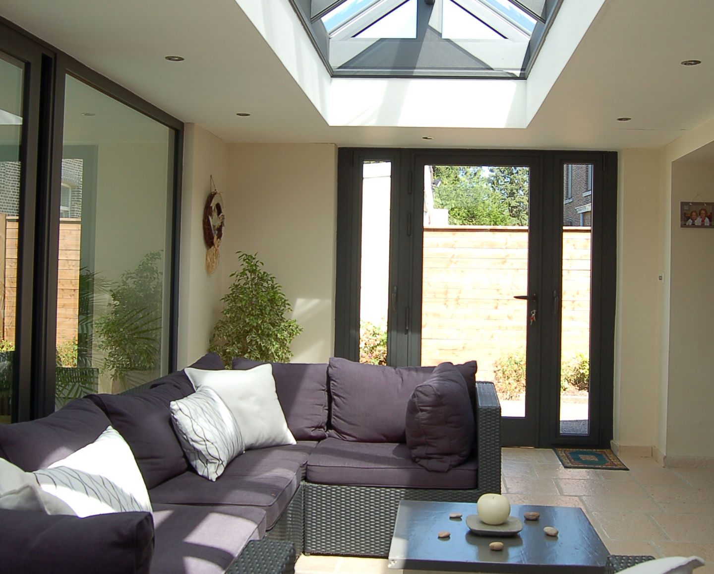 Roof lantern in a modern home with glass doors