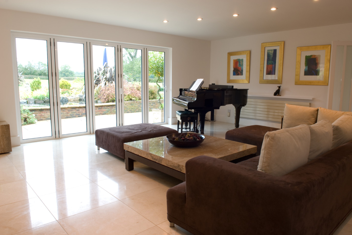 Visoglide bifolding doors in a luxurious living room with a grand piano